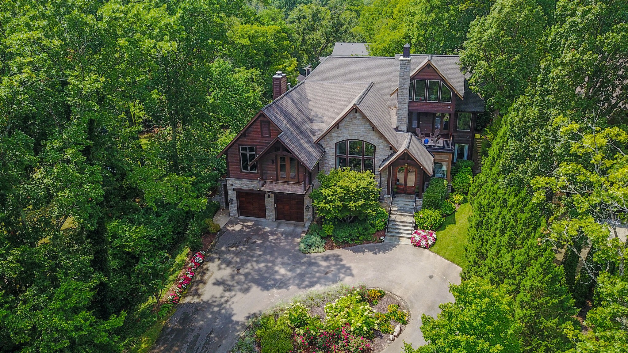 4315 Sneed Road Nashville, TN 37215 - Photo 3 of 50 an aerial view of a house with yard and trees in the background