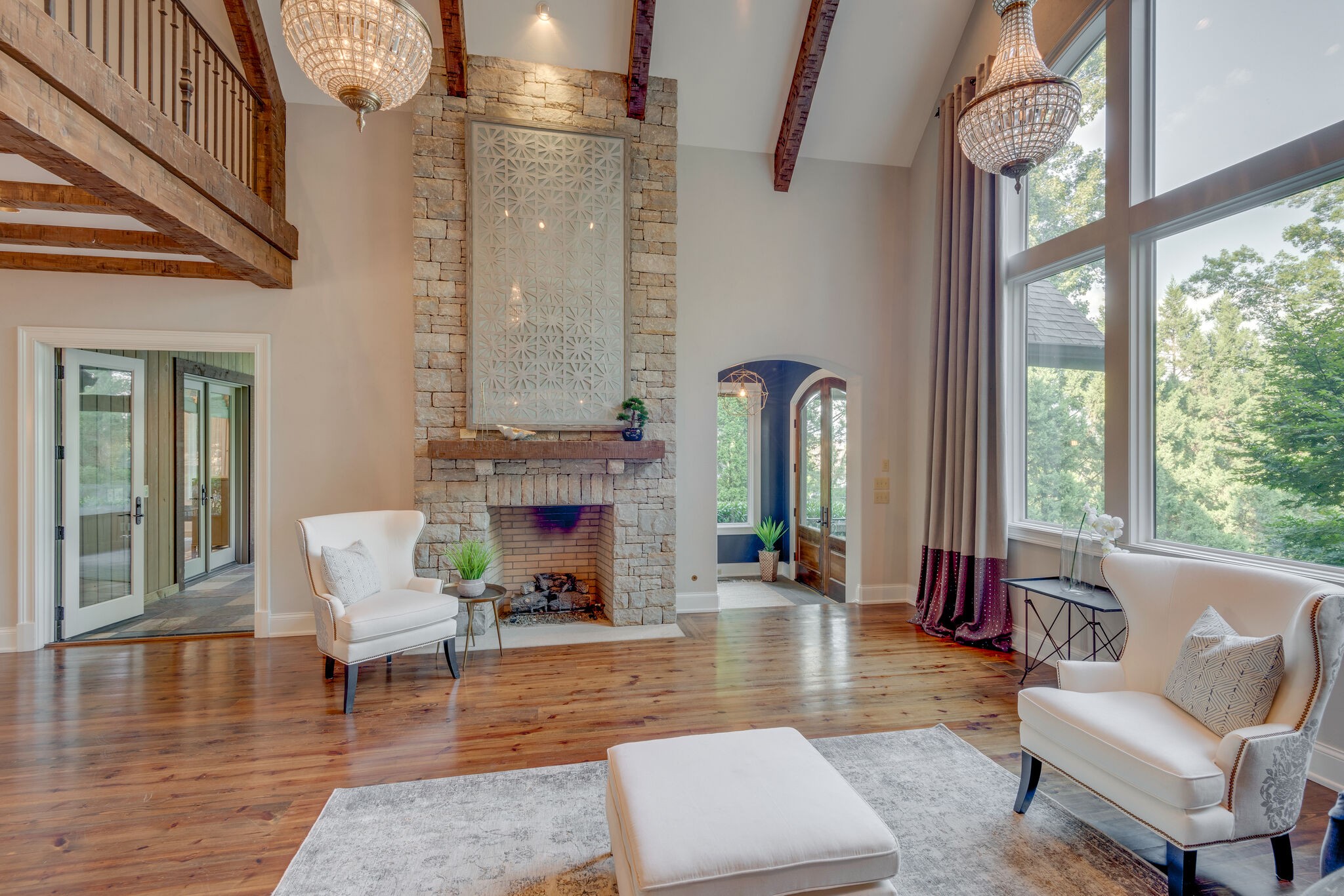 4315 Sneed Road Nashville, TN 37215 - Photo 6 of 50 a living room with furniture a fireplace and a chandelier