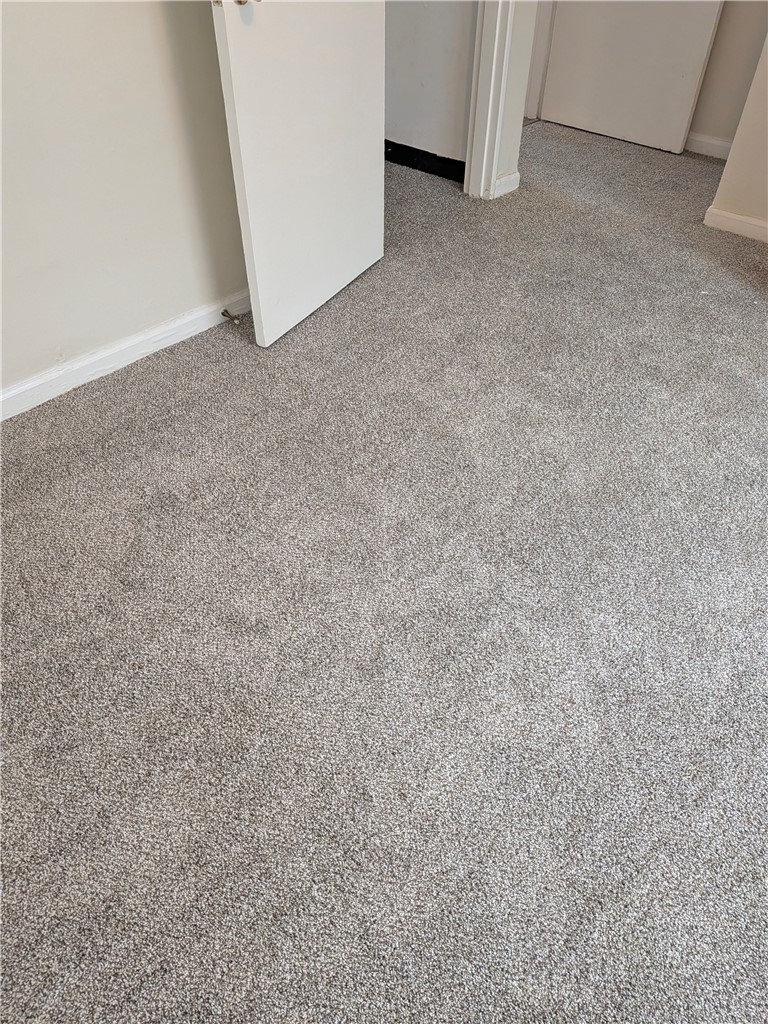 840 Brookfield Road Kettering, OH 45429 - Photo 6 of 13 Soft, plush carpeting provides comfort underfoot, enhancing the inviting atmosphere of this room.