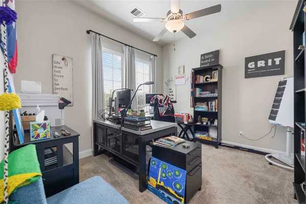 a view of a workspace with furniture and toys