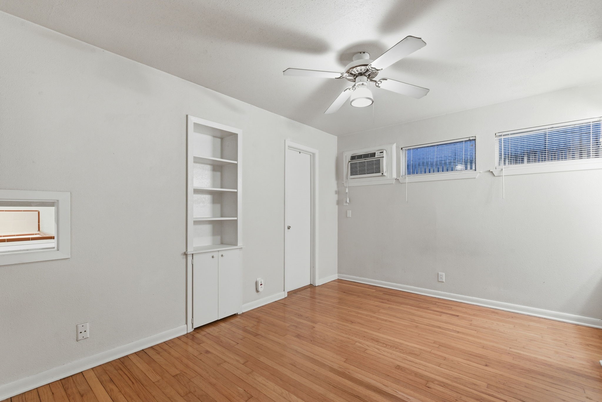 1941 Lexington Street, Unit 6 Houston, TX 77098 - Photo 12 of 50 a view of an empty room with wooden floor