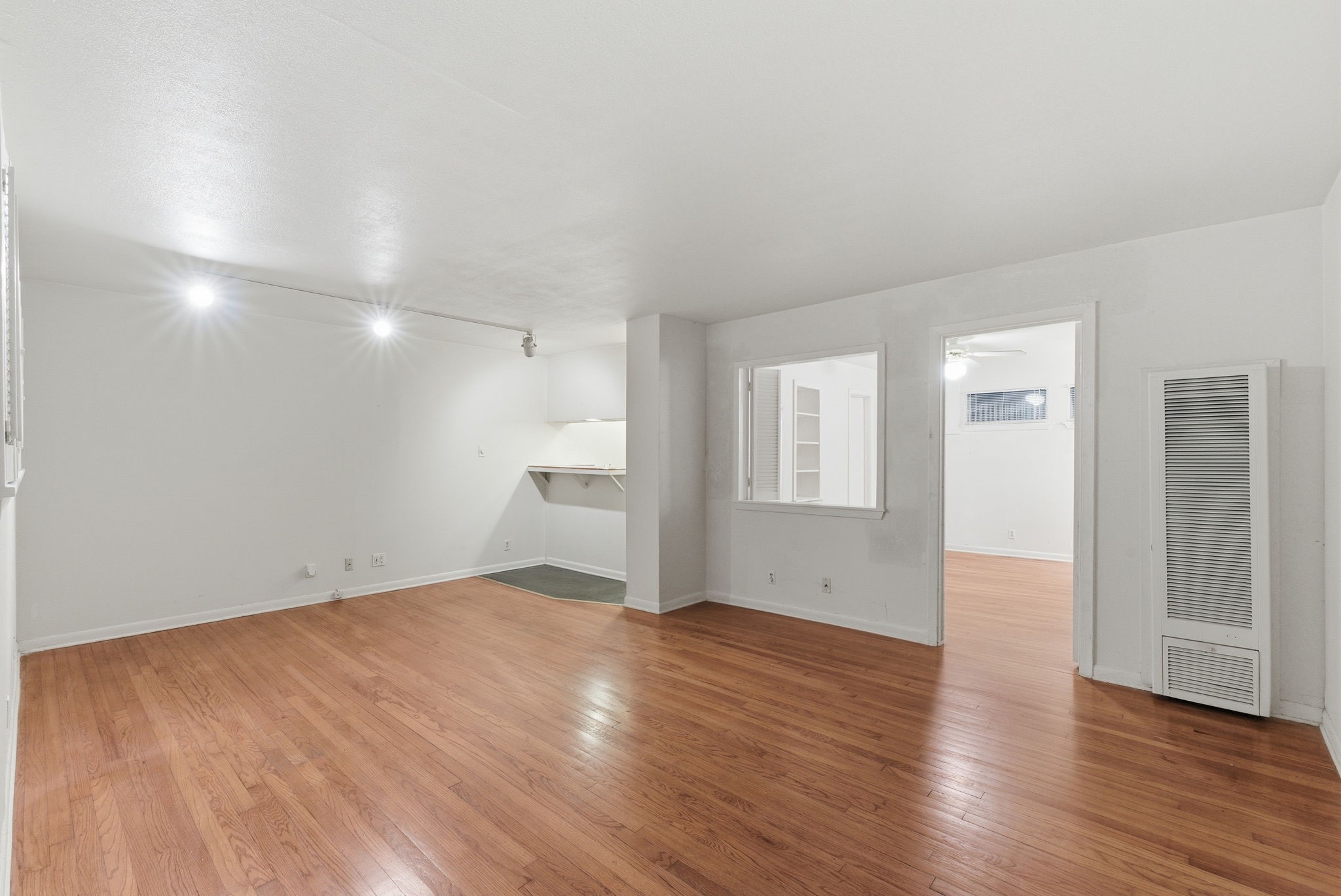 1941 Lexington Street, Unit 6 Houston, TX 77098 - Photo 24 of 50 a view of empty room with wooden floor and window
