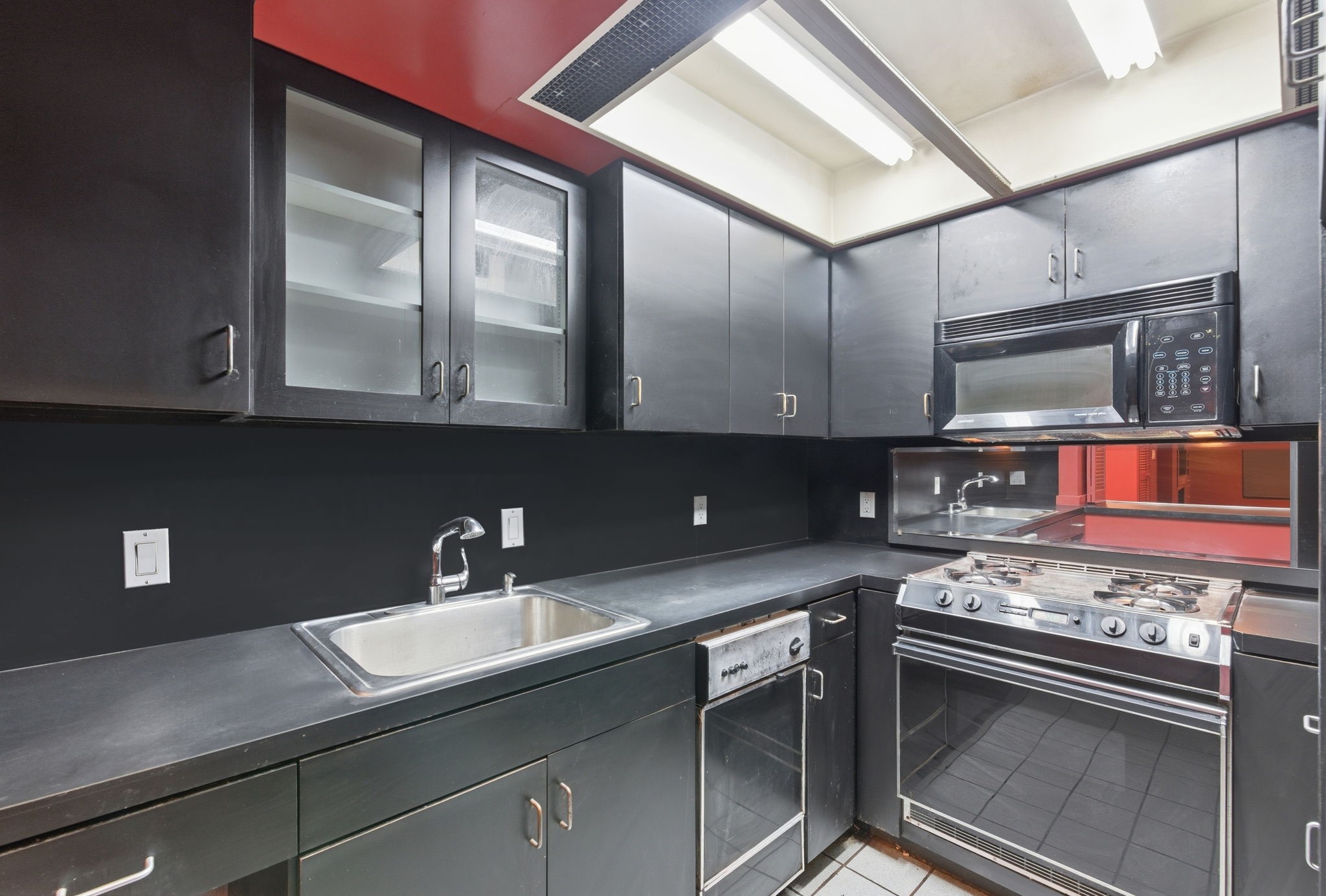 1941 Lexington Street, Unit 6 Houston, TX 77098 - Photo 41 of 50 a kitchen with stainless steel appliances granite countertop a sink stove and cabinets