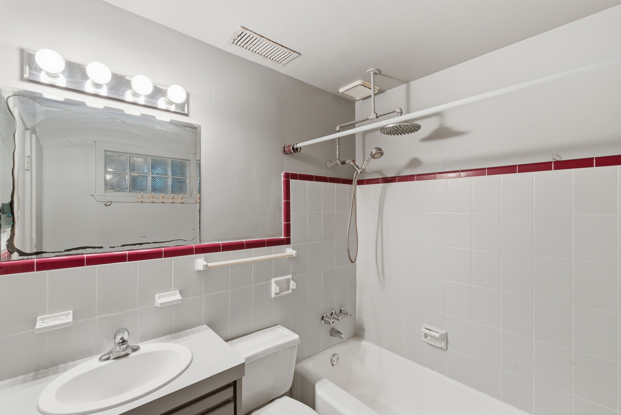 1941 Lexington Street, Unit 6 Houston, TX 77098 - Photo 43 of 50 a bathroom with a sink mirror vanity and toilet