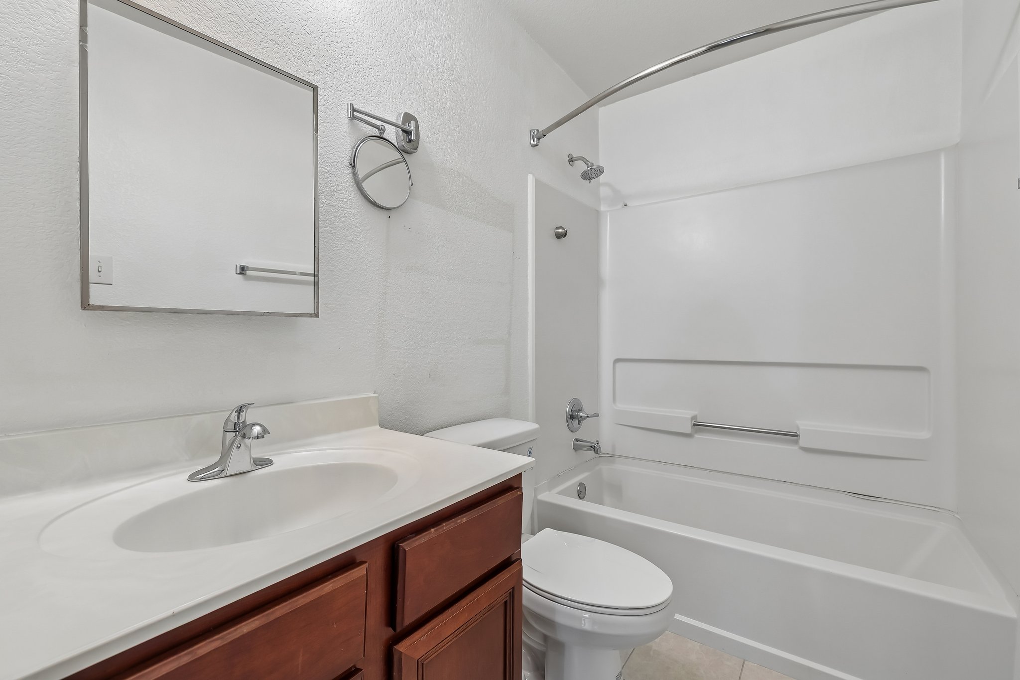 7658 Marble Ridge Drive Austin, TX 78747 - Photo 20 of 34 a bathroom with a granite countertop sink a toilet and shower