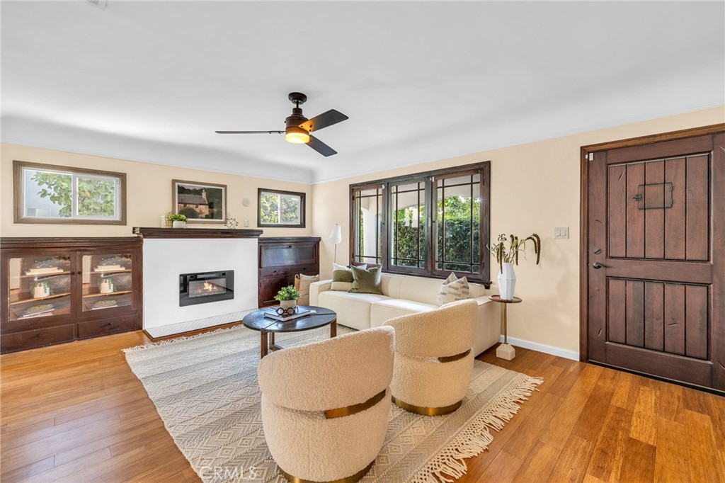 6620 Vesper Avenue Van Nuys, CA 91405 - Photo 2 of 40 a living room with fireplace furniture and a wooden floor