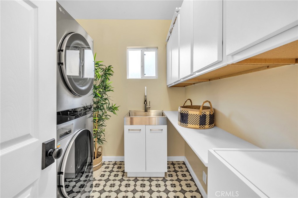 6620 Vesper Avenue Van Nuys, CA 91405 - Photo 26 of 40 a kitchen with a refrigerator a sink and cabinets