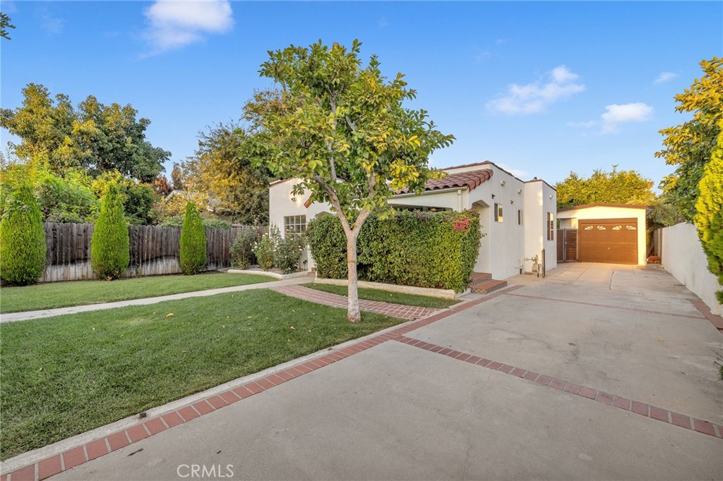 6620 Vesper Avenue Van Nuys, CA 91405 - Photo 34 of 40 a view of a house with a yard and tree s