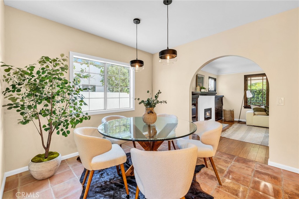 6620 Vesper Avenue Van Nuys, CA 91405 - Photo 6 of 40 a living room with furniture potted plant and a chandelier
