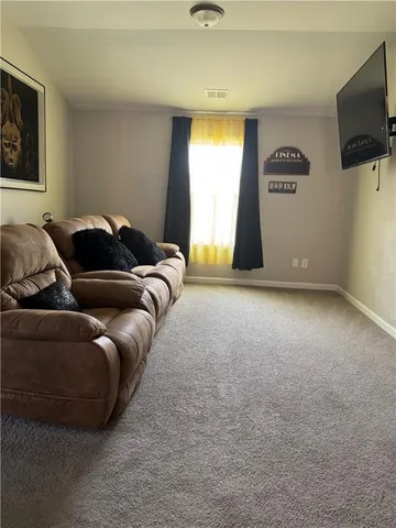 a view of room with stairs and a couch
