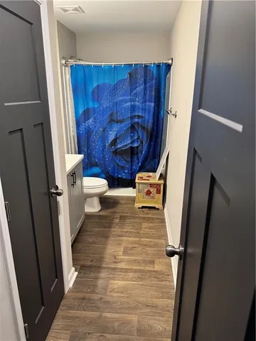 a bathroom with a sink and toilet