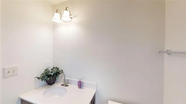 a bathroom with a shower and a curtain