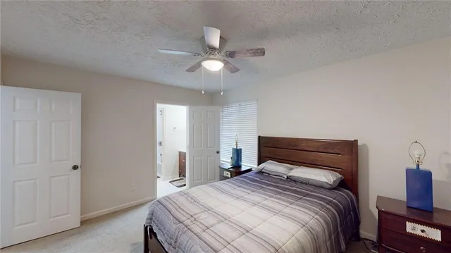 a view of wooden floor and chandelier fan in a room