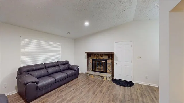 a hallway with a bench and a fireplace