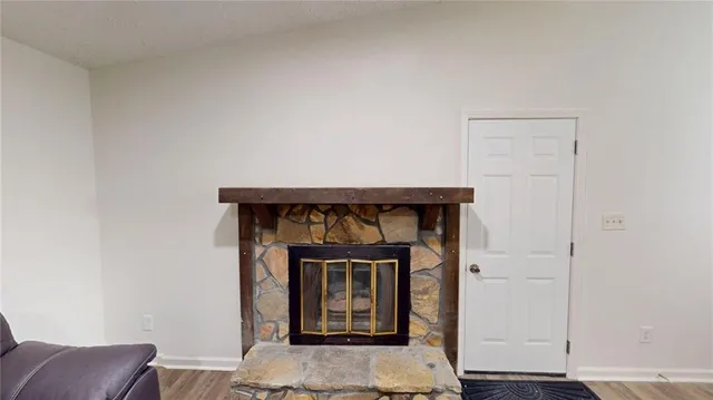 a living room with a couch and a refrigerator