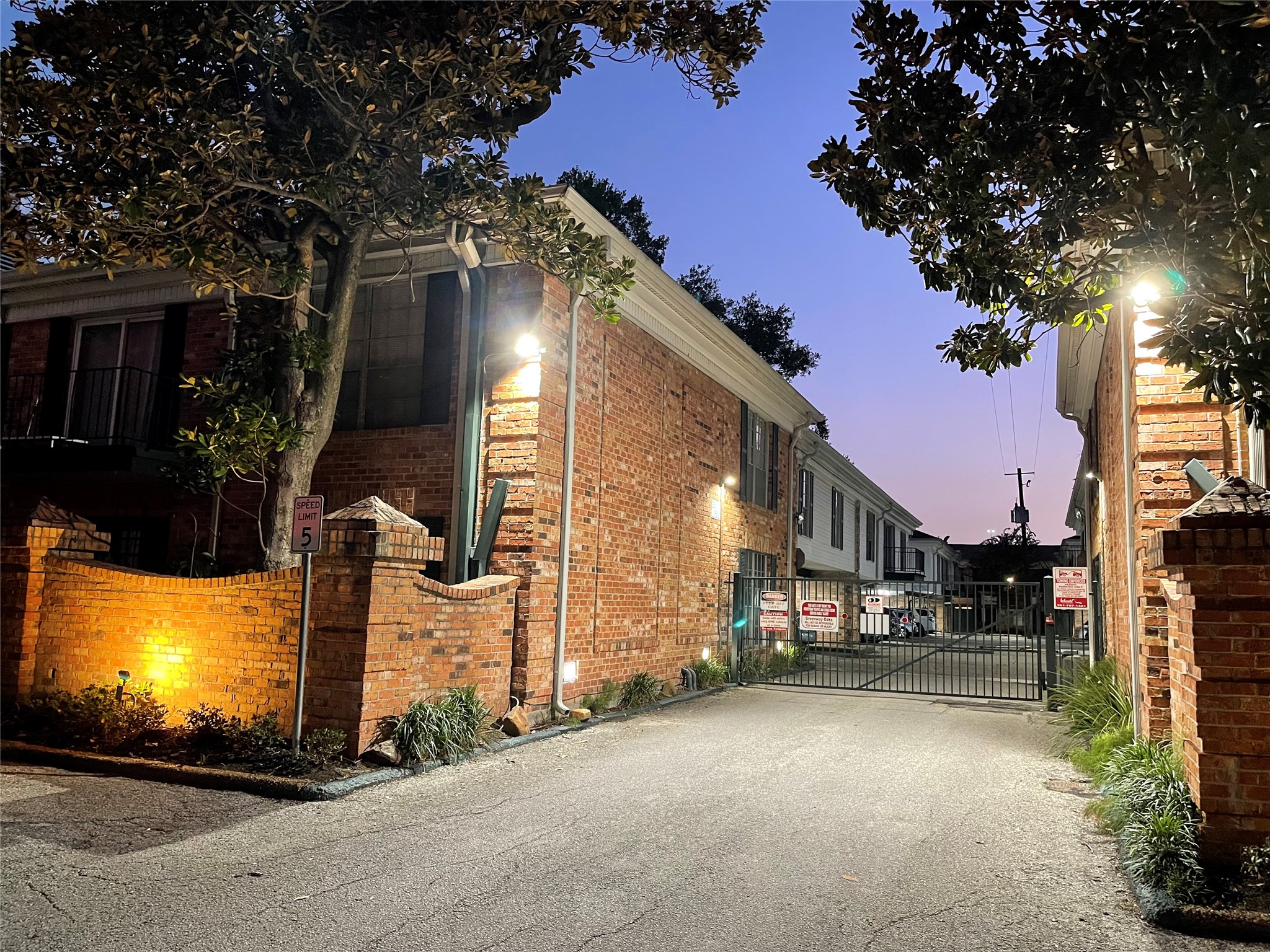 3400 Timmons Lane, Unit 13 Houston, TX 77027 - Photo 6 of 35 a city street with tall buildings