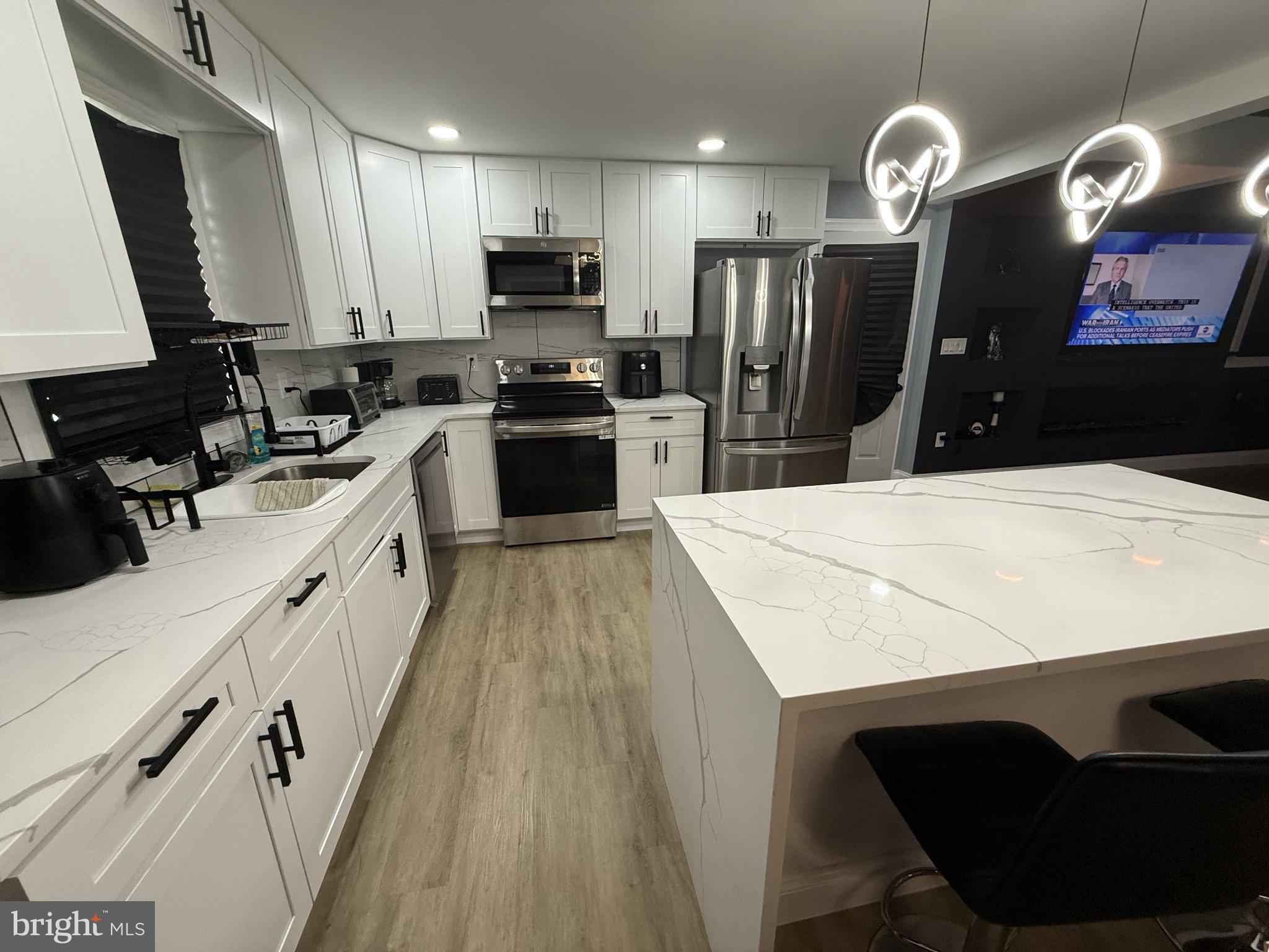 7022 Highbridge Road Bowie, MD 20720 - Photo 3 of 9 Sleek modern kitchen with elegant finishes.