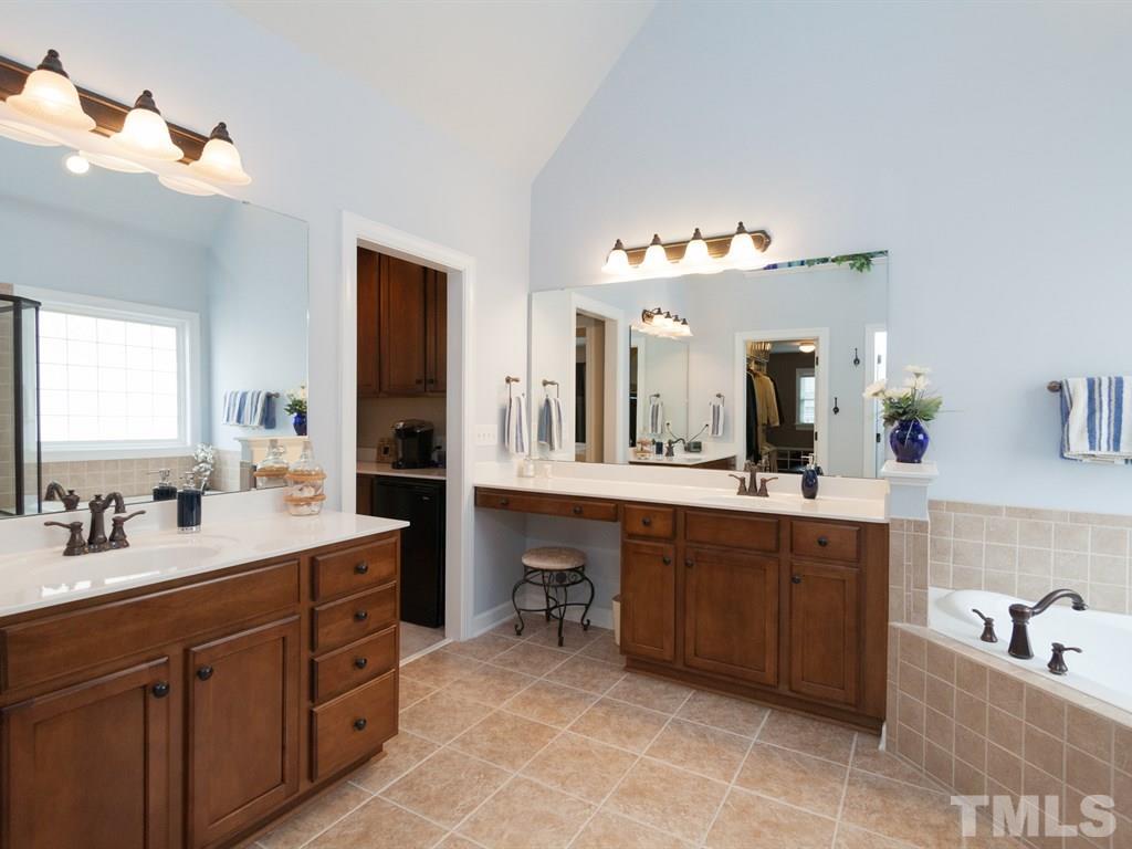 5968 Jones Farm Road Wake Forest, NC 27587 - Photo 16 of 25 Garden tub and separate vanities
