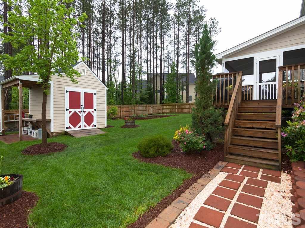 5968 Jones Farm Road Wake Forest, NC 27587 - Photo 24 of 25 Deck connected to side of Screened Porch. Perfect for grilling or enjoying the sun. Custom 10x10 built shed, garden area etc....