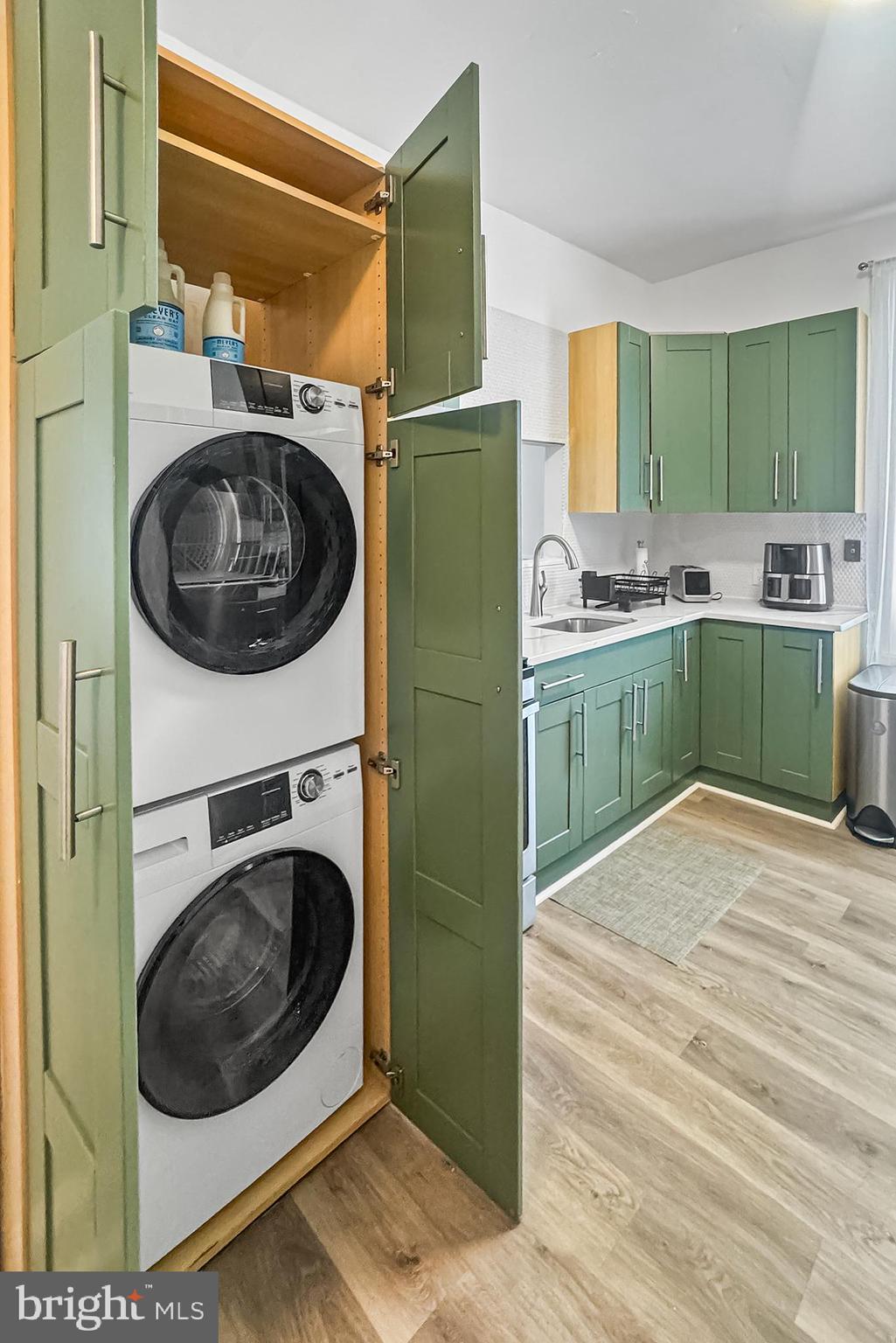 569 North 20th Street, Unit 2F Philadelphia, PA 19130 - Photo 9 of 21 a kitchen with a washer and dryer in it