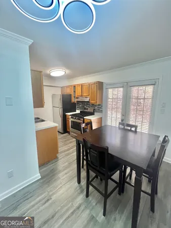 a view of a dining room with furniture and wooden floor