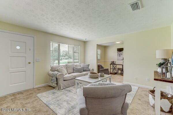 490 Sigsbee Road Orange Park, FL 32073 - Photo 4 of 33 a living room with furniture and a large window