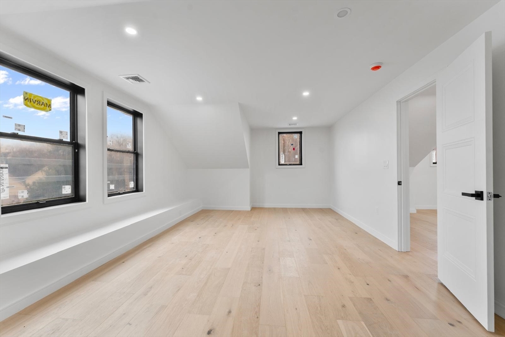 212 Central Avenue Needham, MA 02494 - Photo 20 of 29 a view of an empty room with a window