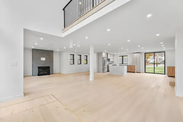 a view of kitchen with wooden cabinet and stainless steel appliances