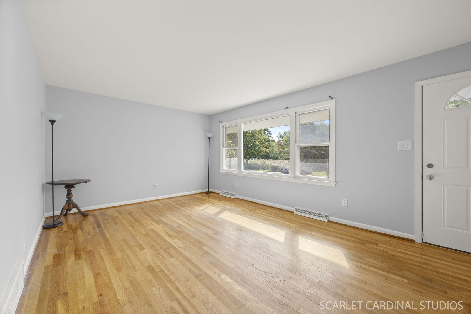 27W300 Beecher Avenue Winfield, IL 60190 - Photo 3 of 16 a view of an empty room with wooden floor and a window