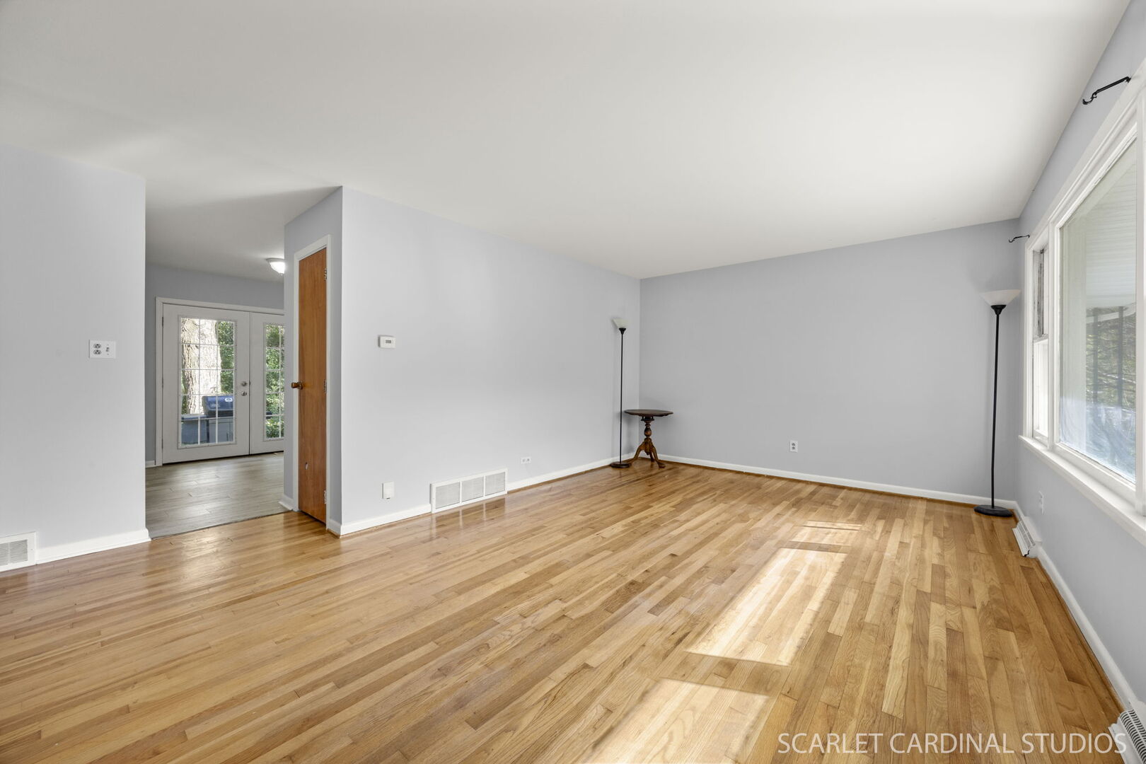 27W300 Beecher Avenue Winfield, IL 60190 - Photo 4 of 16 wooden floor in an empty room with a window