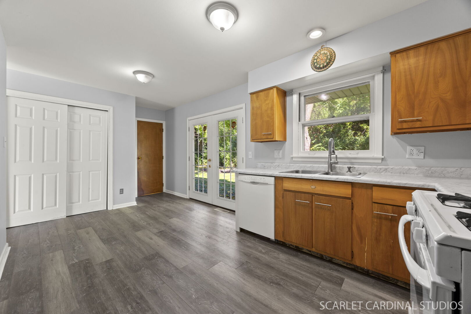 27W300 Beecher Avenue Winfield, IL 60190 - Photo 8 of 16 a view of a kitchen with wooden floor and a sink