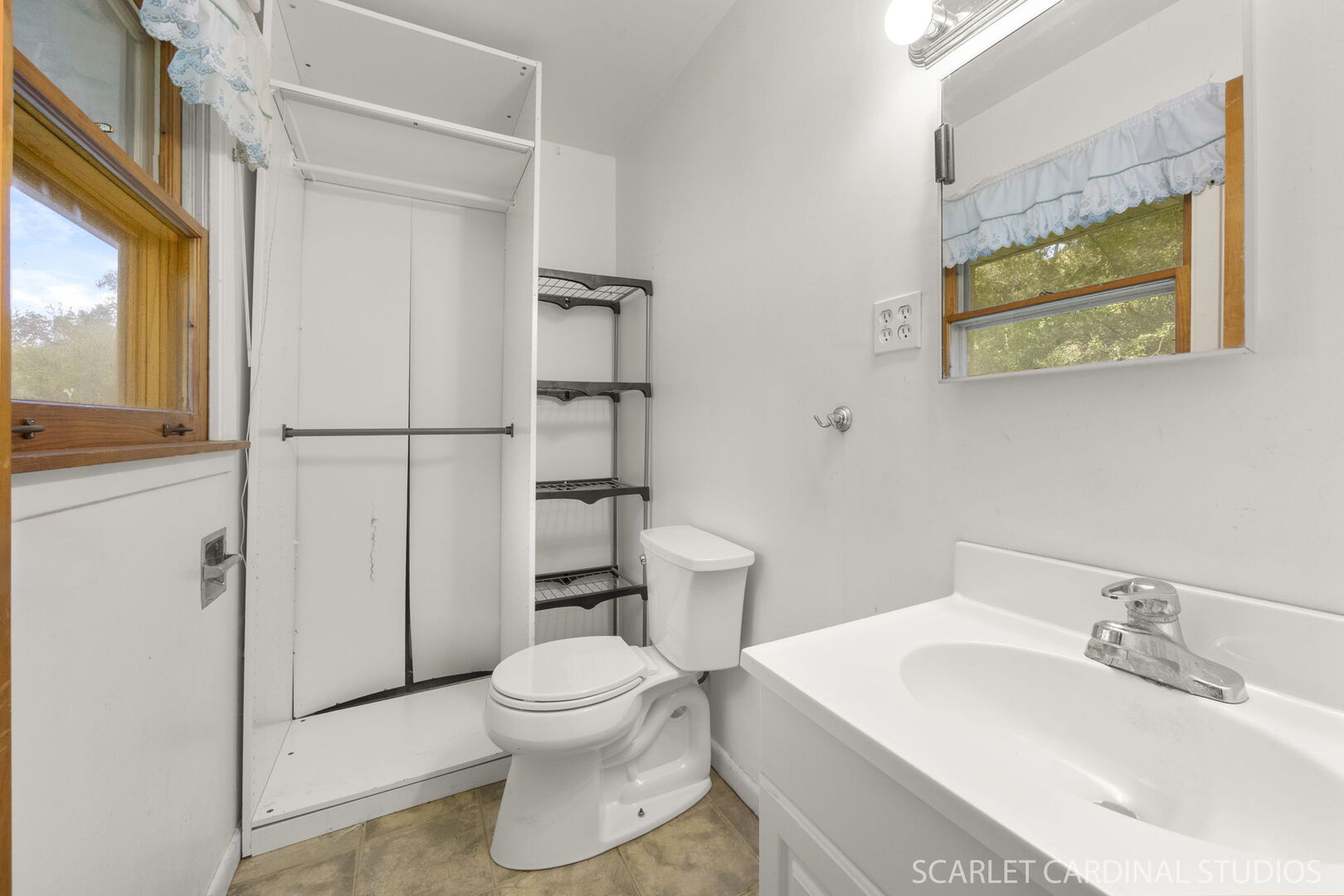 27W300 Beecher Avenue Winfield, IL 60190 - Photo 10 of 16 a white toilet sitting next to a bathroom sink