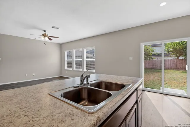 a kitchen with a sink and a window