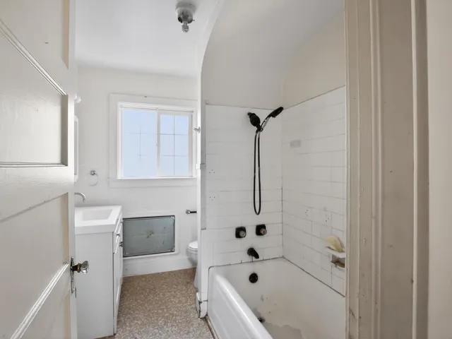a bathroom with a sink and window