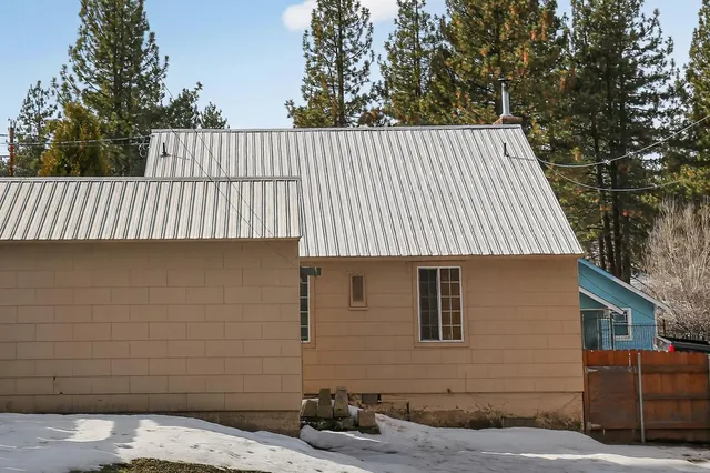 a back view of a house with a patio