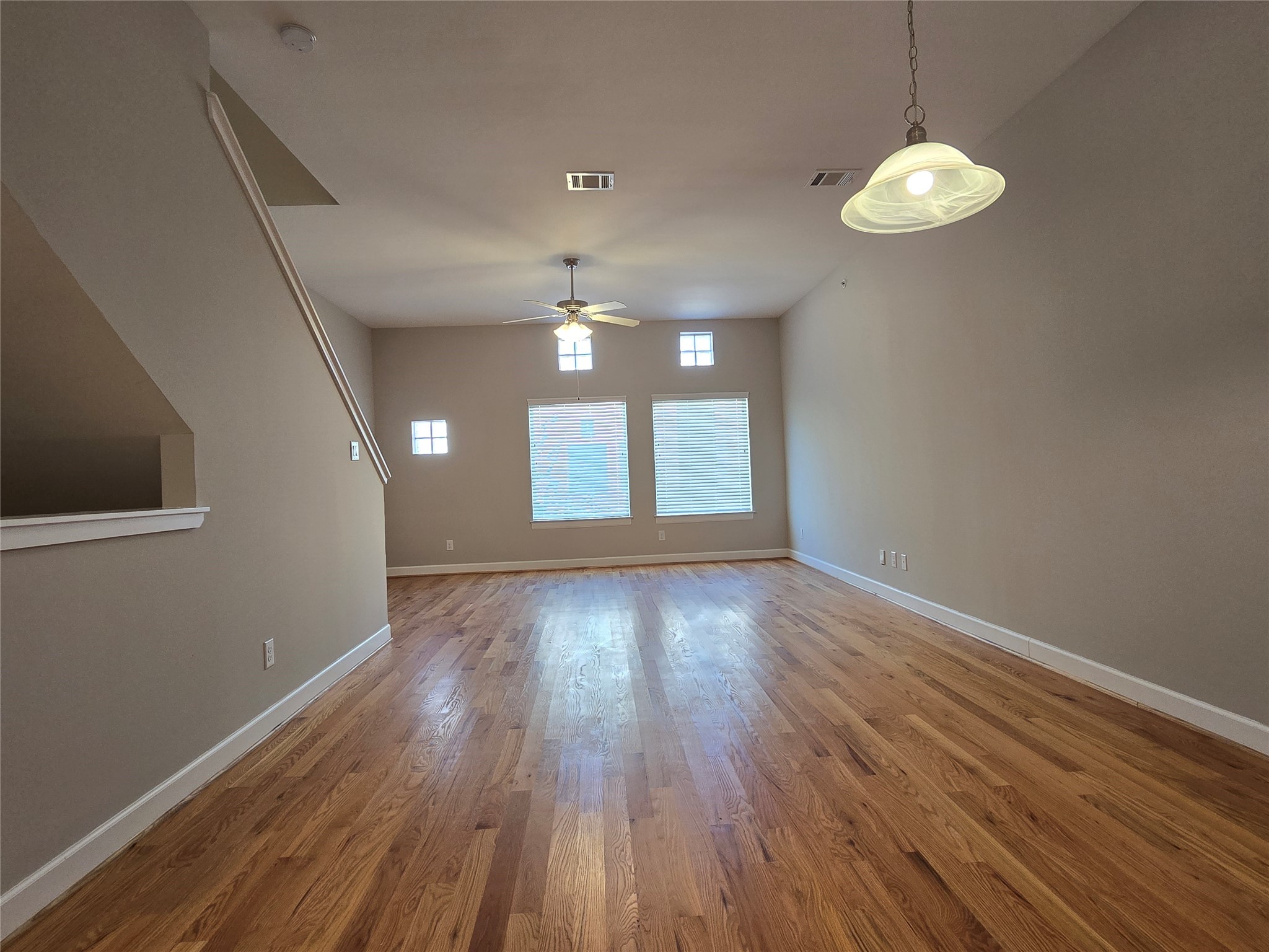 8705 Bryam Street, Unit 1701 Houston, TX 77061 - Photo 5 of 22 wooden floor in an empty room with a window