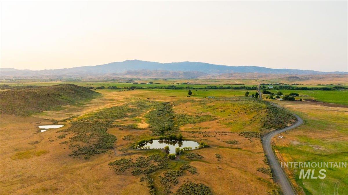 3127 Highway 95 Cambridge, ID 83610 - Photo 20 of 49 Aerial view of property and surrounding area featuring a mountainous background