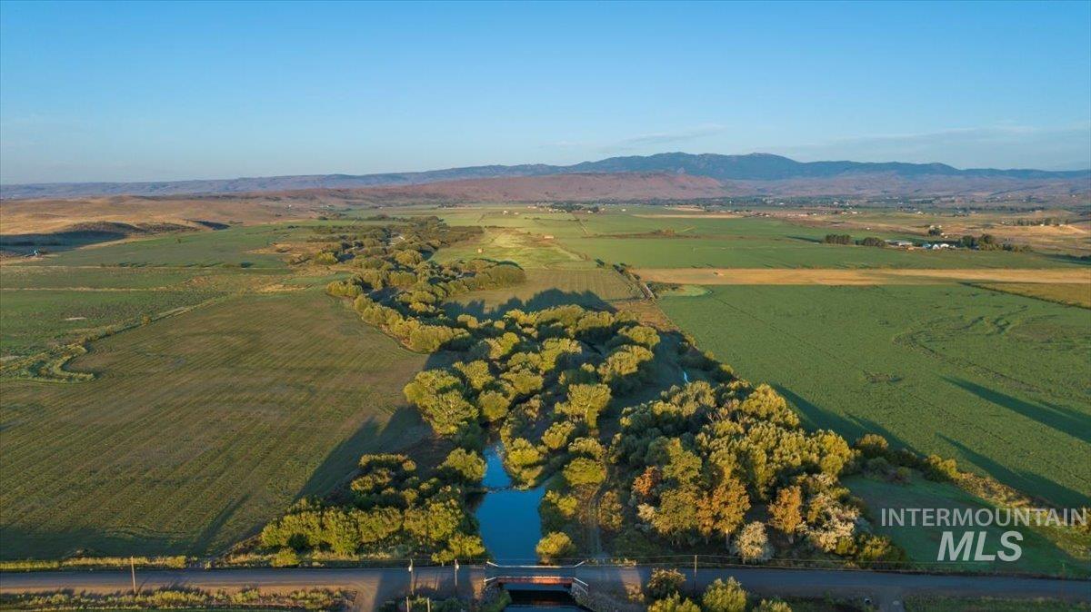 3127 Highway 95 Cambridge, ID 83610 - Photo 42 of 49 Aerial view of property and surrounding area featuring rural landscape and a mountainous background
