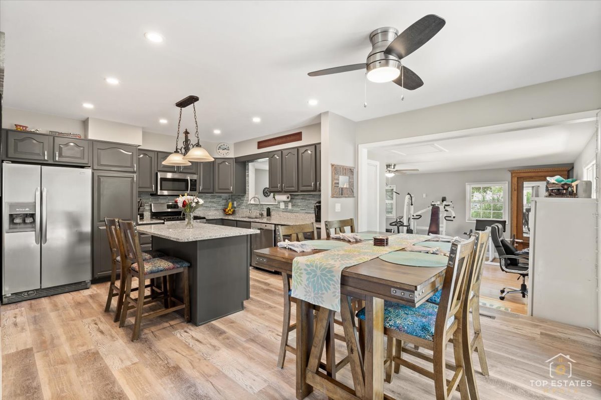 120-3 Three Oaks Road Cary, IL 60013 - Photo 13 of 28 a large kitchen with a table and chairs