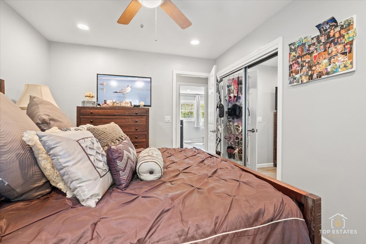 120-3 Three Oaks Road Cary, IL 60013 - Photo 19 of 28 a bed sitting in a bedroom next to a window