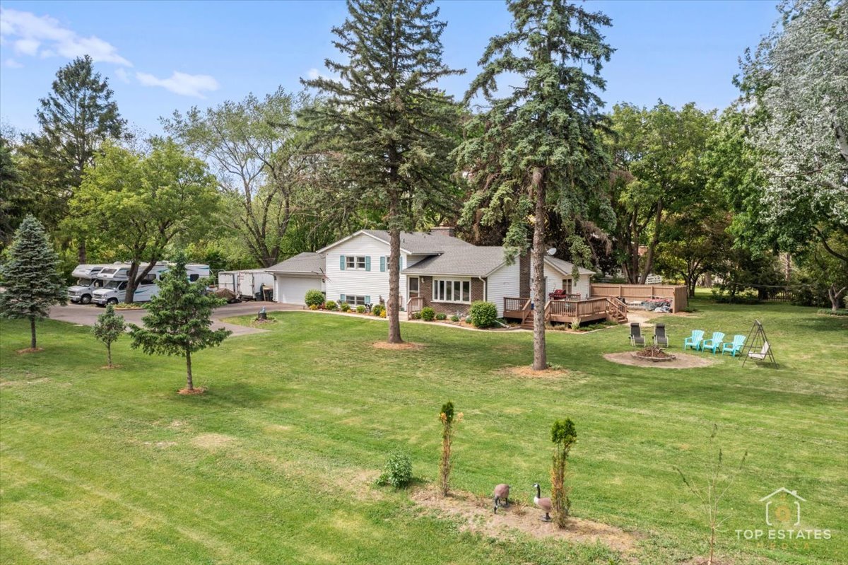120-3 Three Oaks Road Cary, IL 60013 - Photo 2 of 28 a garden view with a seating space
