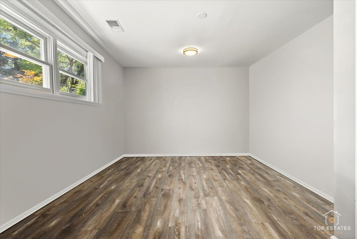 120-3 Three Oaks Road Cary, IL 60013 - Photo 21 of 28 an empty room with windows