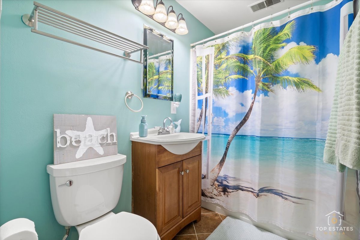 120-3 Three Oaks Road Cary, IL 60013 - Photo 22 of 28 a bathroom with a sink toilet and shower