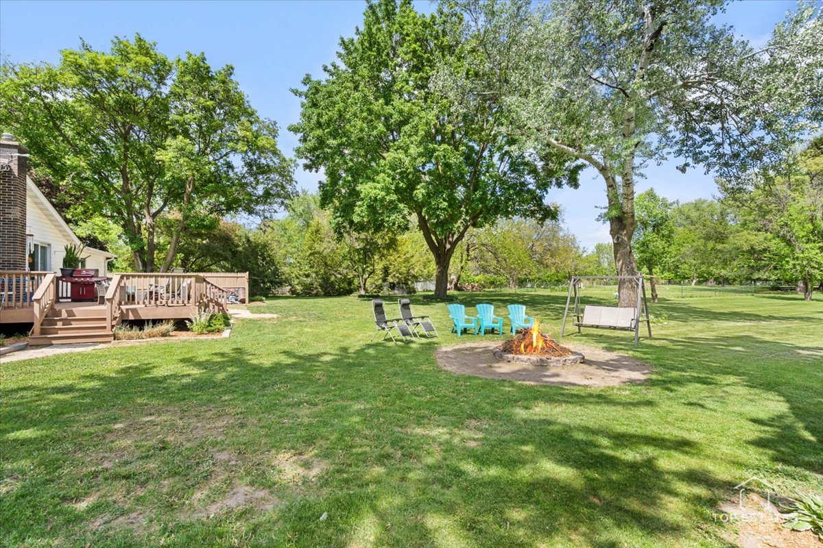 120-3 Three Oaks Road Cary, IL 60013 - Photo 27 of 28 a backyard of a house with table and chairs