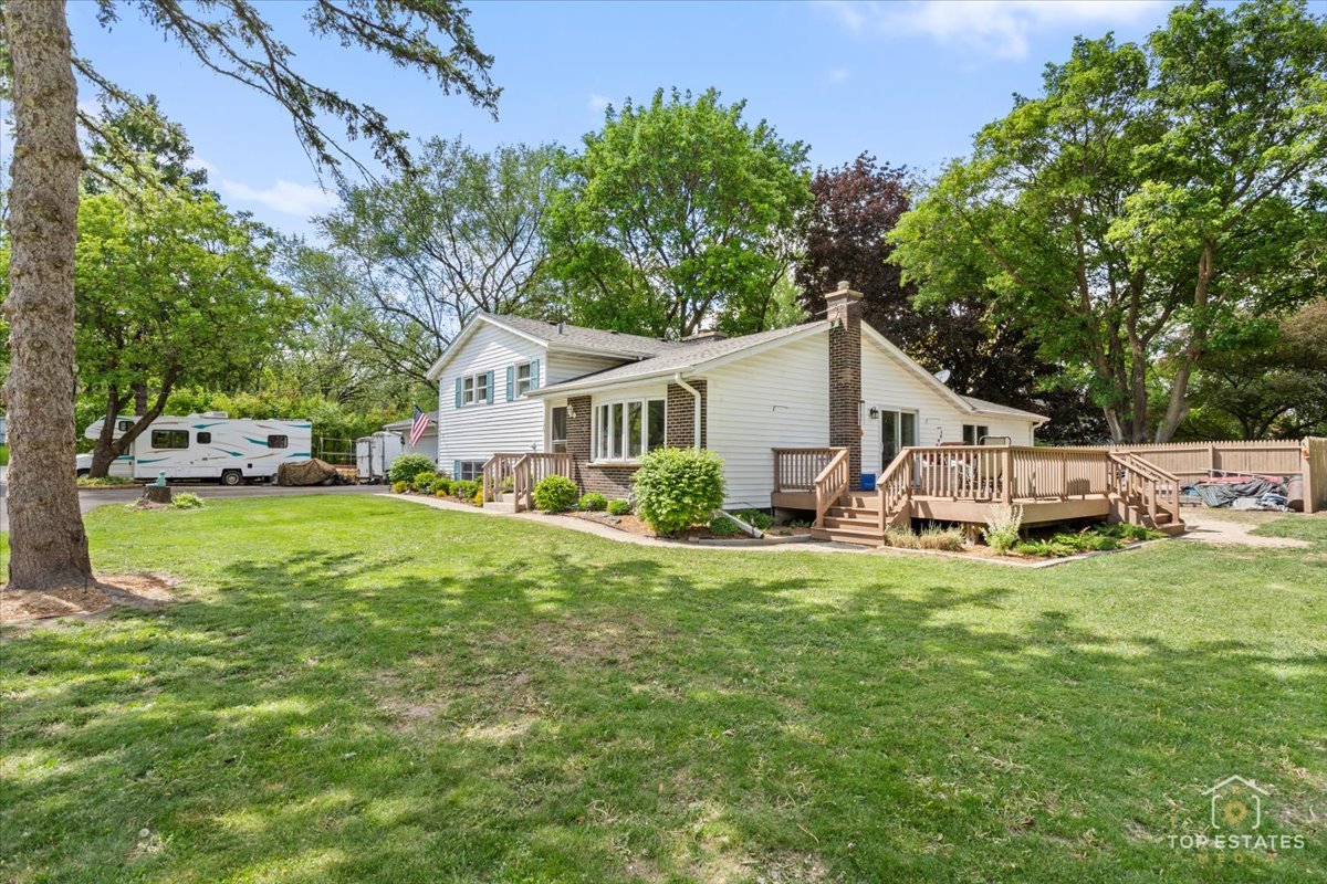 120-3 Three Oaks Road Cary, IL 60013 - Photo 3 of 28 a view of a house with a yard and sitting area
