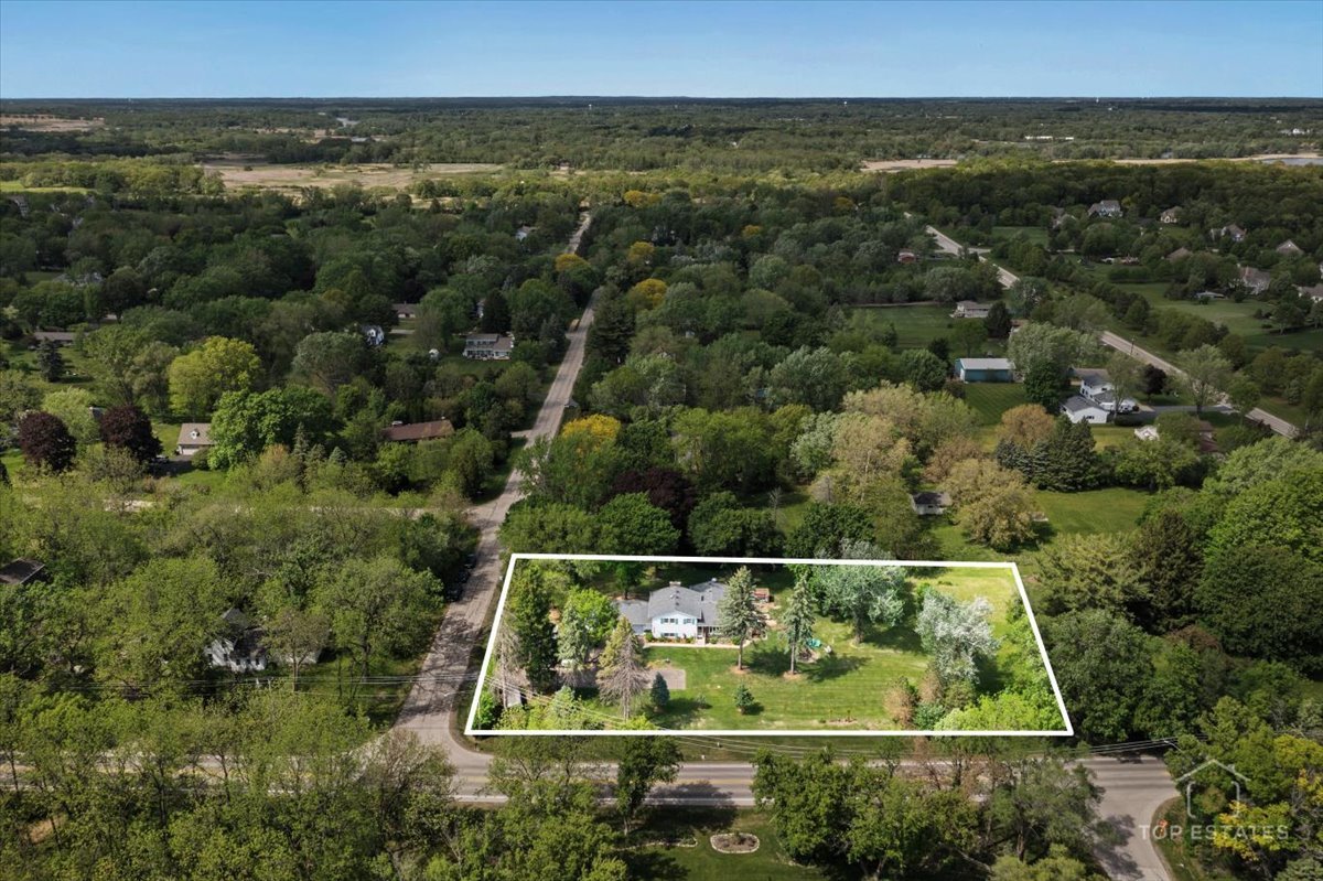 120-3 Three Oaks Road Cary, IL 60013 - Photo 7 of 28 an aerial view of a house with a yard