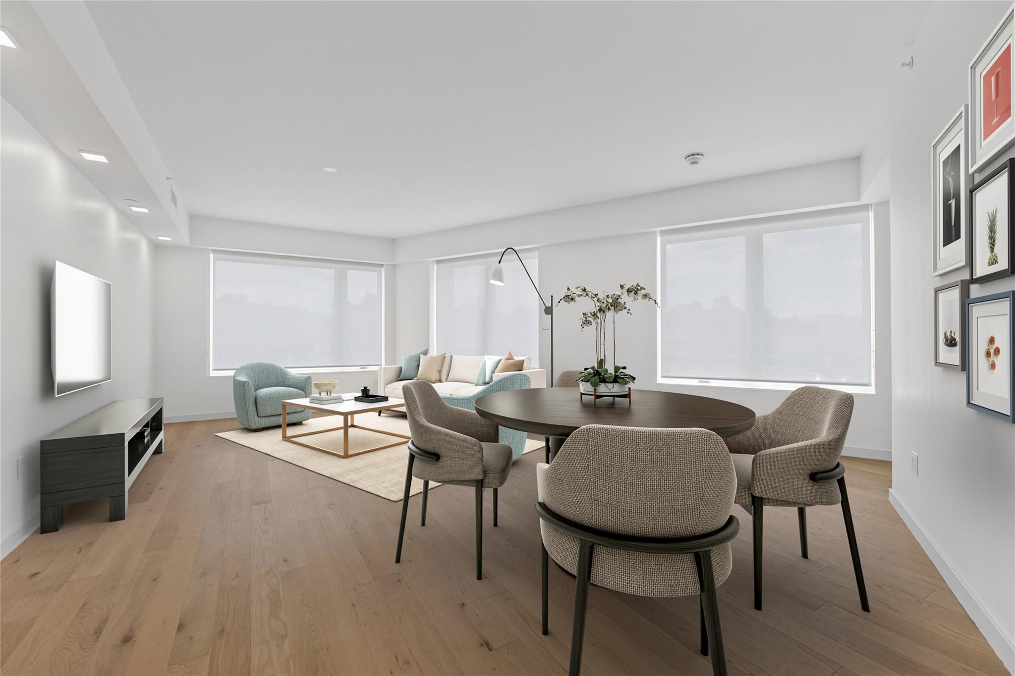 Dining area with light wood-style floors, plenty of natural light, and recessed lighting