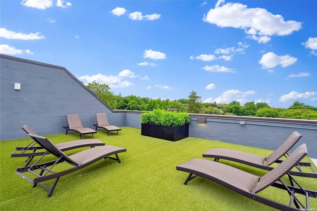 a sitting area with pool table and chairs
