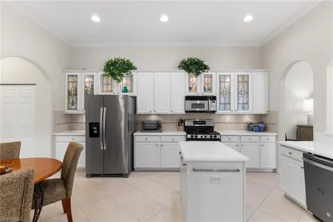 a bedroom with a bed and a lamp with window