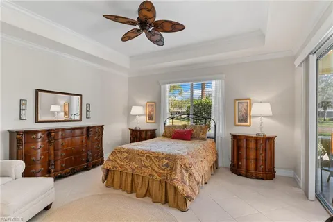 a view of a dining room with furniture and a chandelier